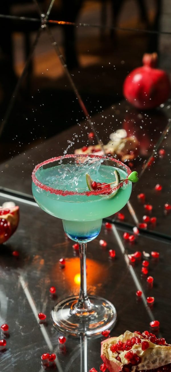 blue-cocktail-with-pomegranate-and-syrup-side-view-2023-11-27-05-14-05-utc